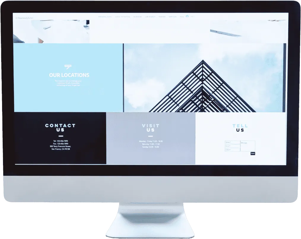 Desktop monitor showing a website with a grid layout of blue, grey, and white panels labeled Our Locations, Contact Us, Visit Us, and Tell Us.